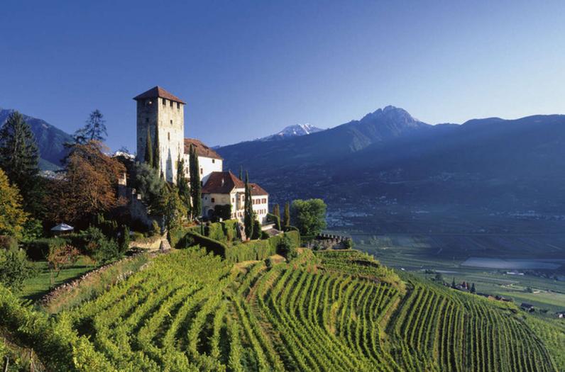 Nestled in fields and vineyards in the mountainside panorama of South Tyrol. Nestled in fields and vineyards in the mountainside panorama of South Tyrol.